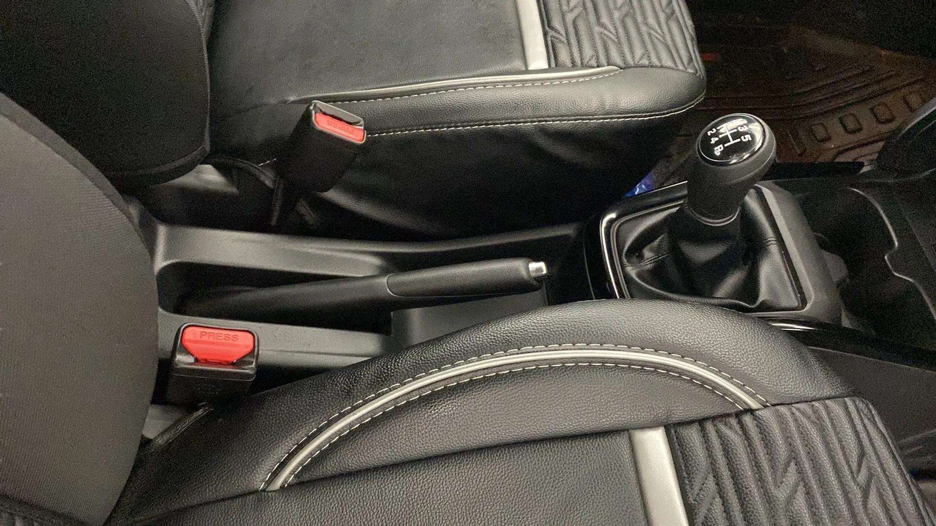 Gear lever and parking brake view of a Maruti Suzuki Swift