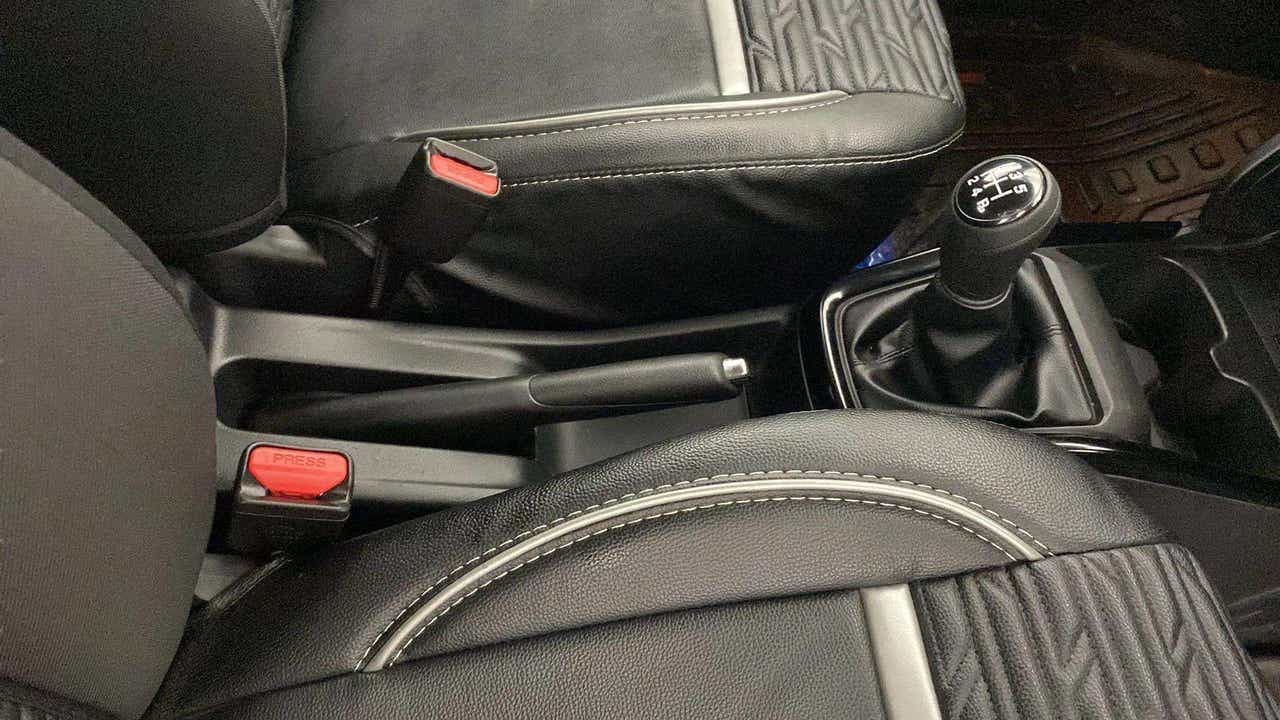 Gear lever and parking brake view of a Maruti Suzuki Swift