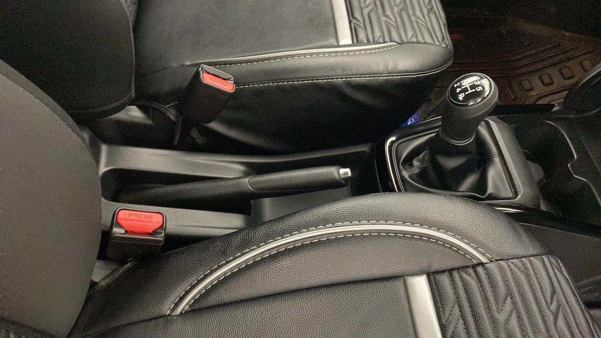 Gear lever and parking brake view of a Maruti Suzuki Swift