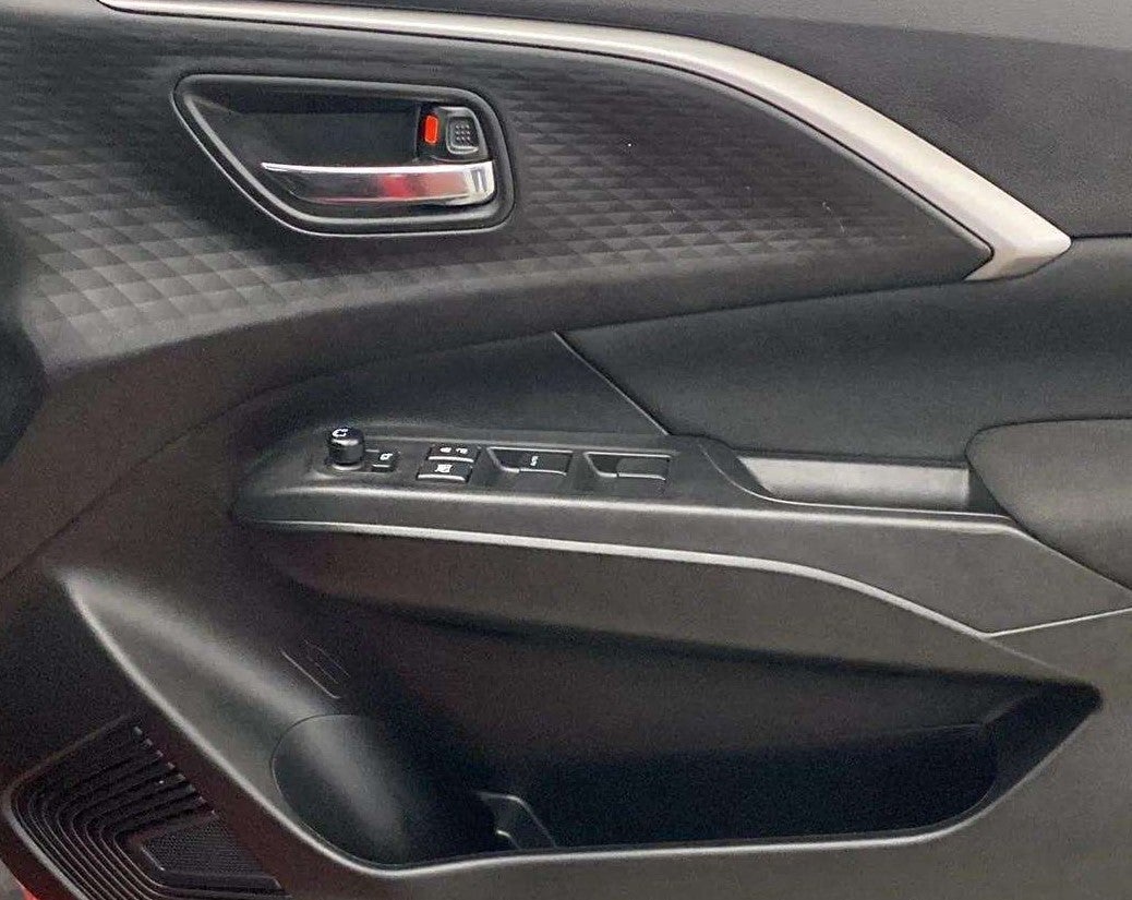 Interior door panel of a Maruti Suzuki Swift