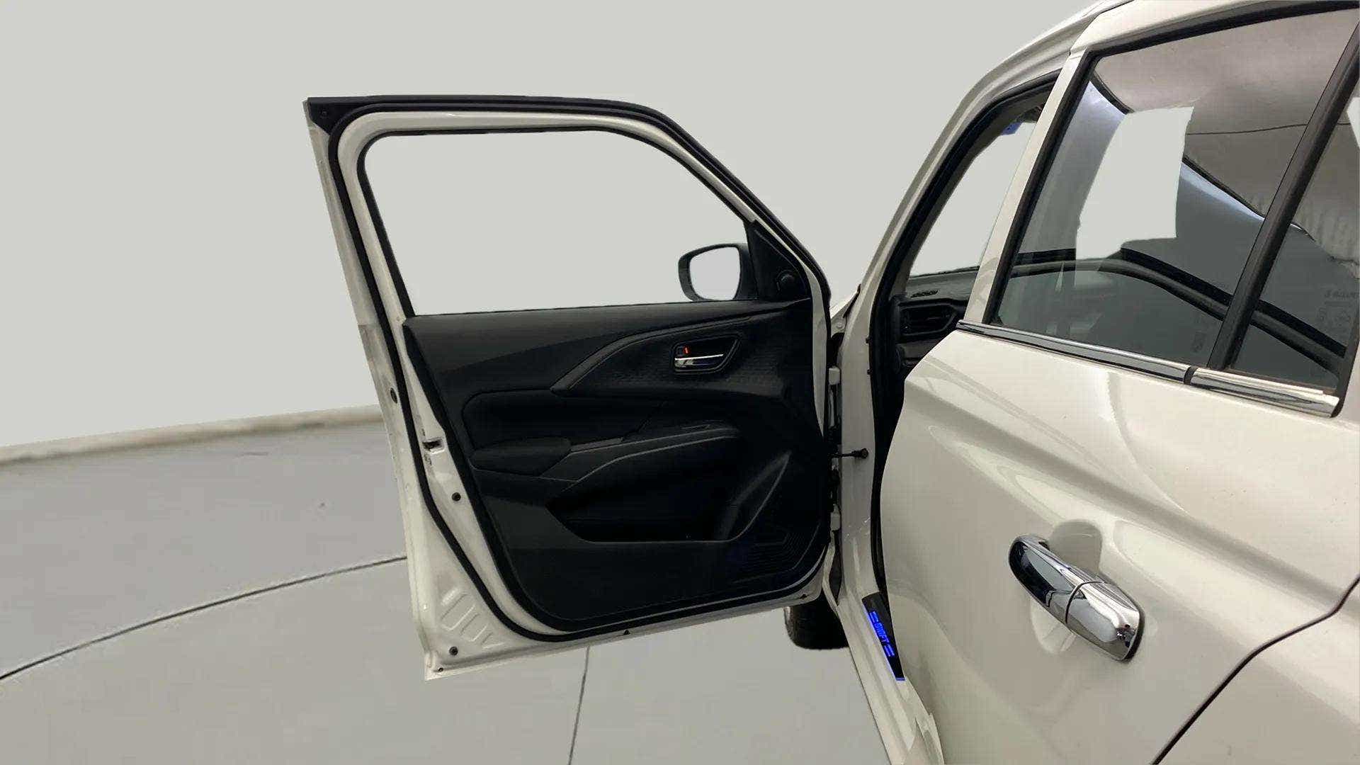 Front driver-side door view of a Maruti Suzuki Swift