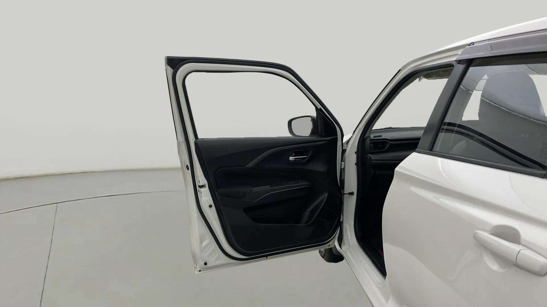 Front driver side door view of a Maruti Suzuki Swift