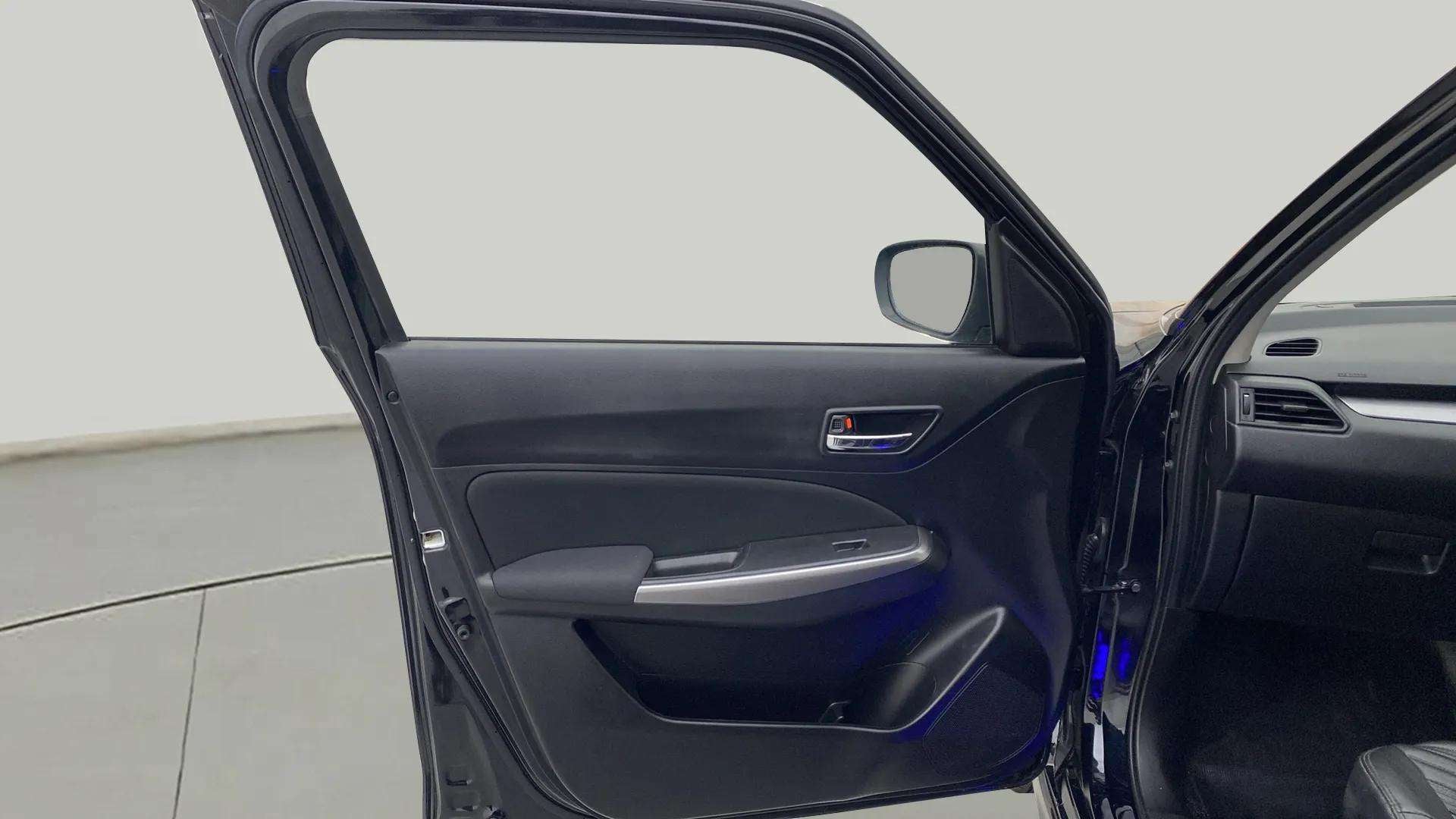 Front door interior of a Maruti Suzuki Swift