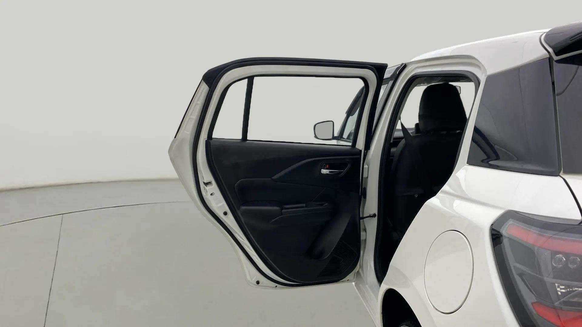 Rear passenger side door open view of a Maruti Suzuki Swift