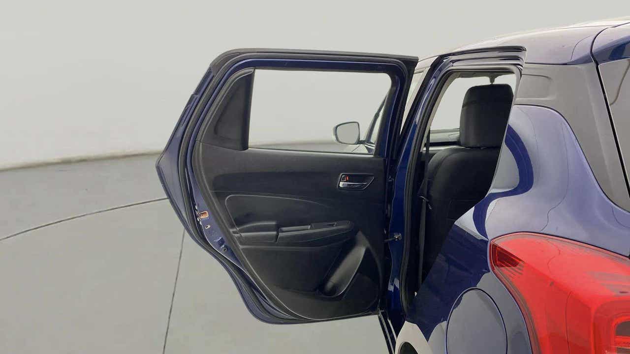 Rear door and taillight view of a Maruti Suzuki Swift