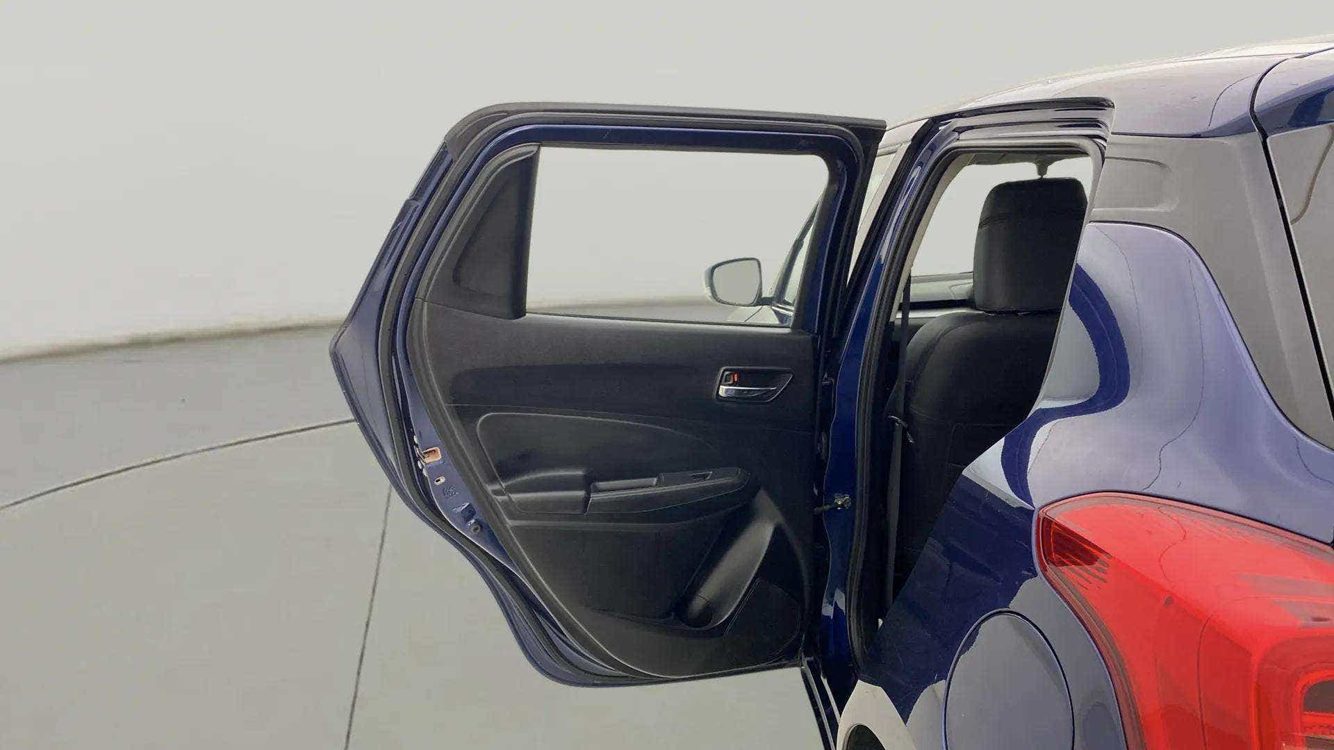 Rear door and taillight view of a Maruti Suzuki Swift