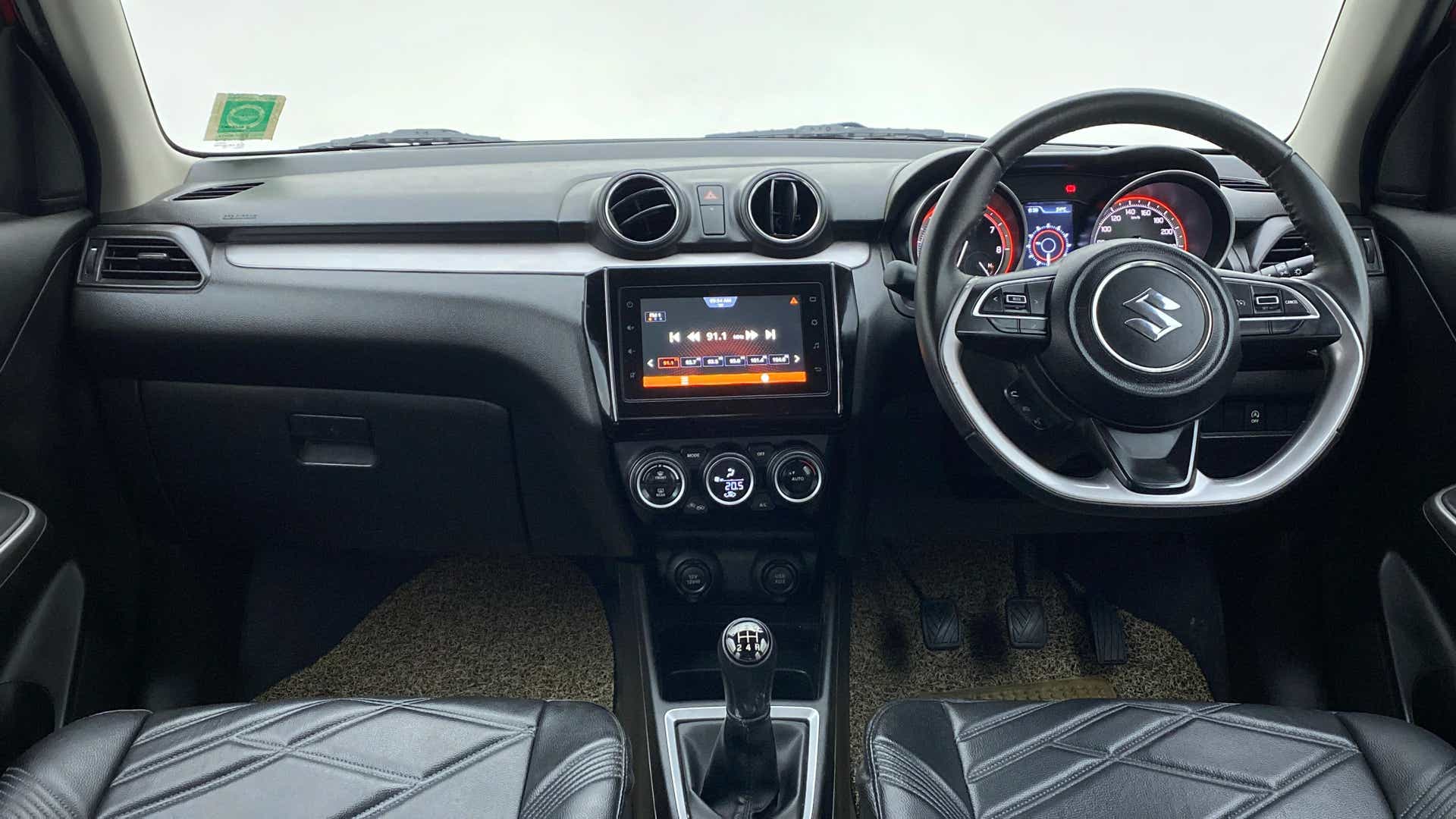 Dashboard and steering view of a Maruti Suzuki Swift 2021 - 2023
