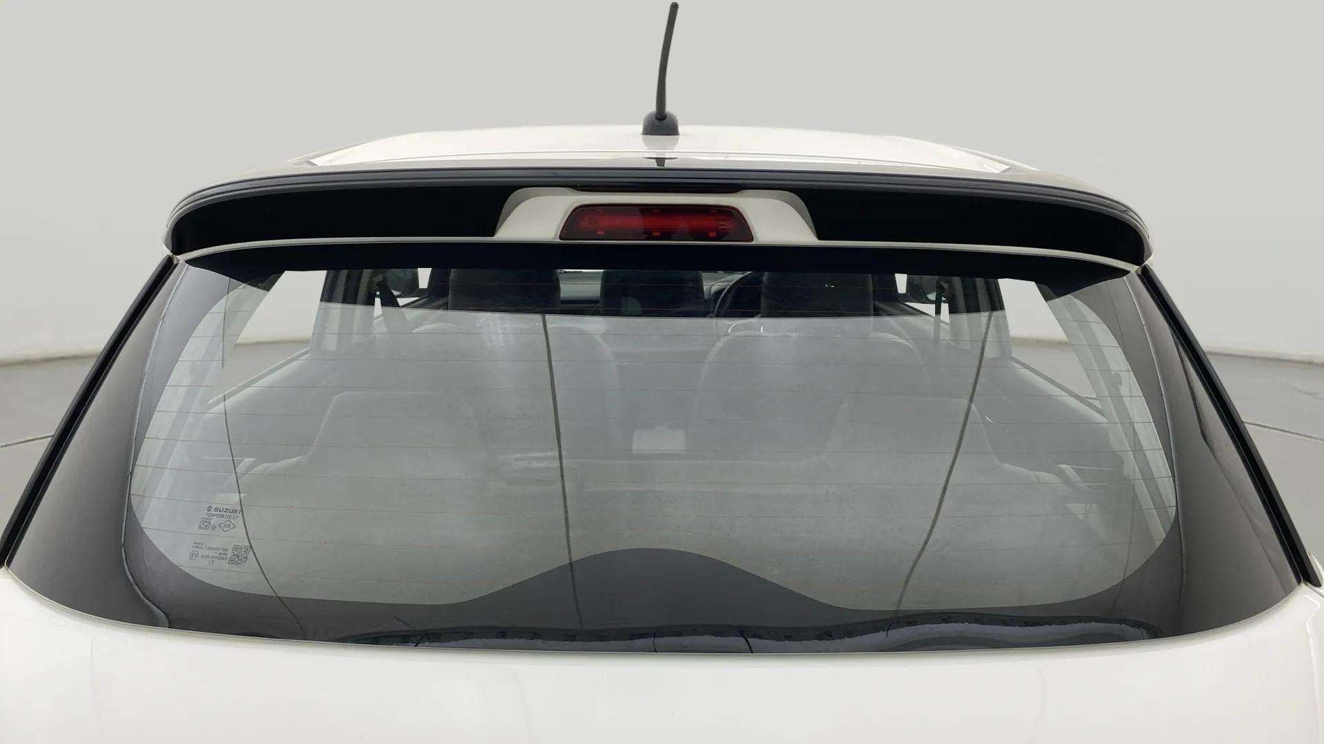 Rear windshield view of a Maruti Suzuki Swift