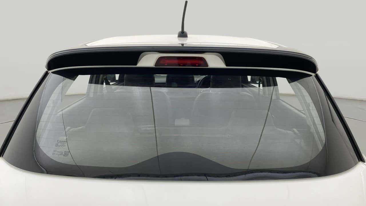 Rear windshield view of a Maruti Suzuki Swift