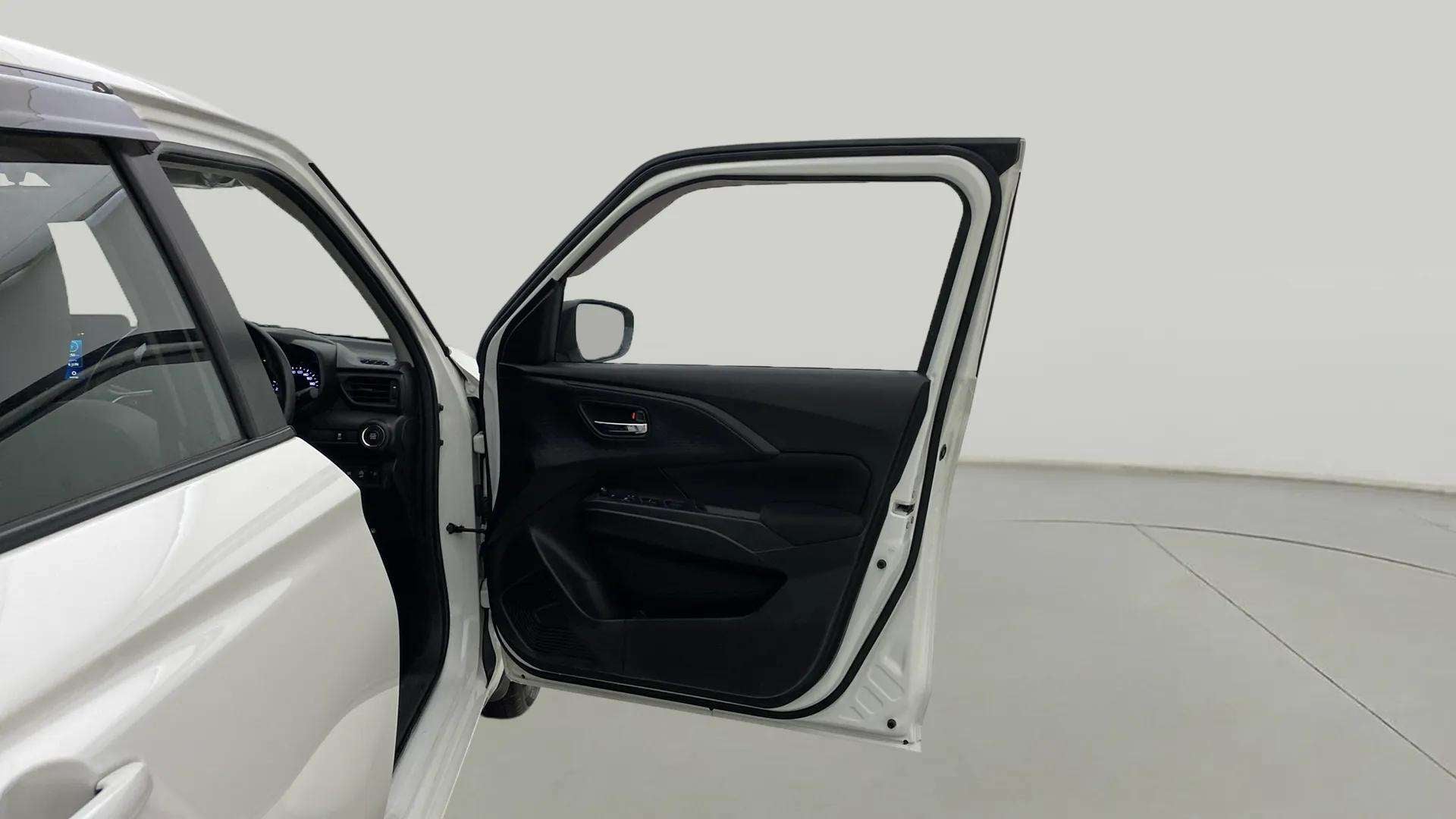 Driver side door panel view of a Maruti Suzuki Swift