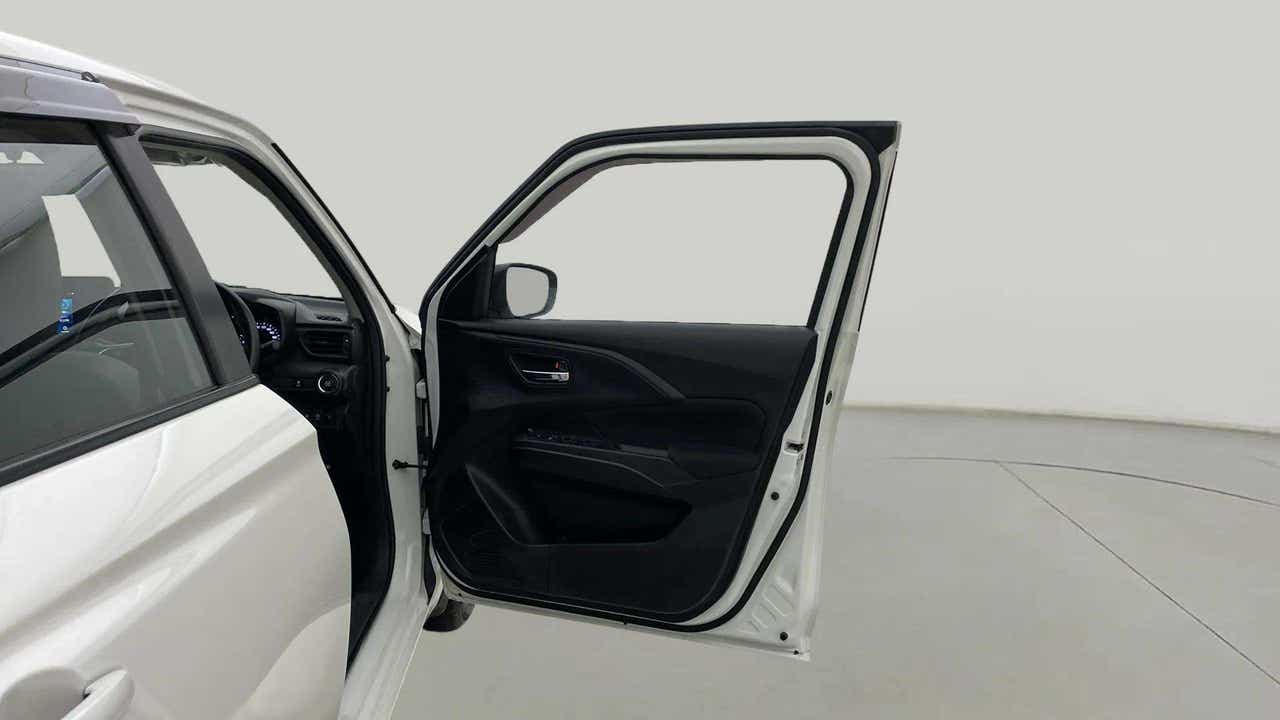 Driver side door panel view of a Maruti Suzuki Swift