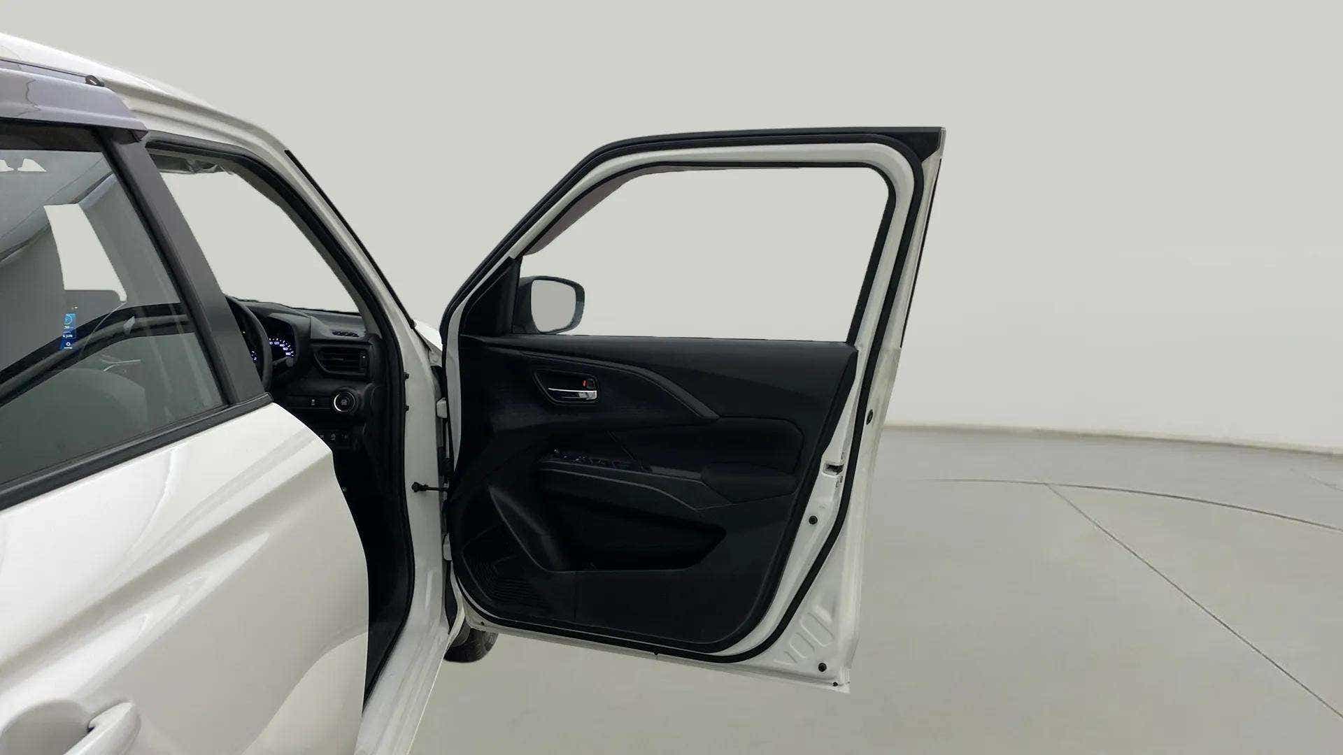 Driver side door panel view of a Maruti Suzuki Swift