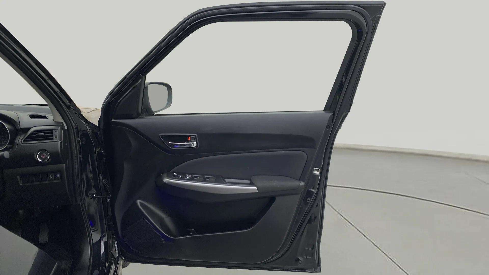 Front driver-side door panel of a Maruti Suzuki Swift
