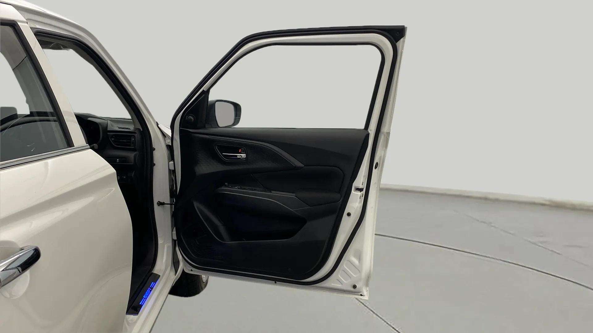 Front door and interior trim of a Maruti Suzuki Swift