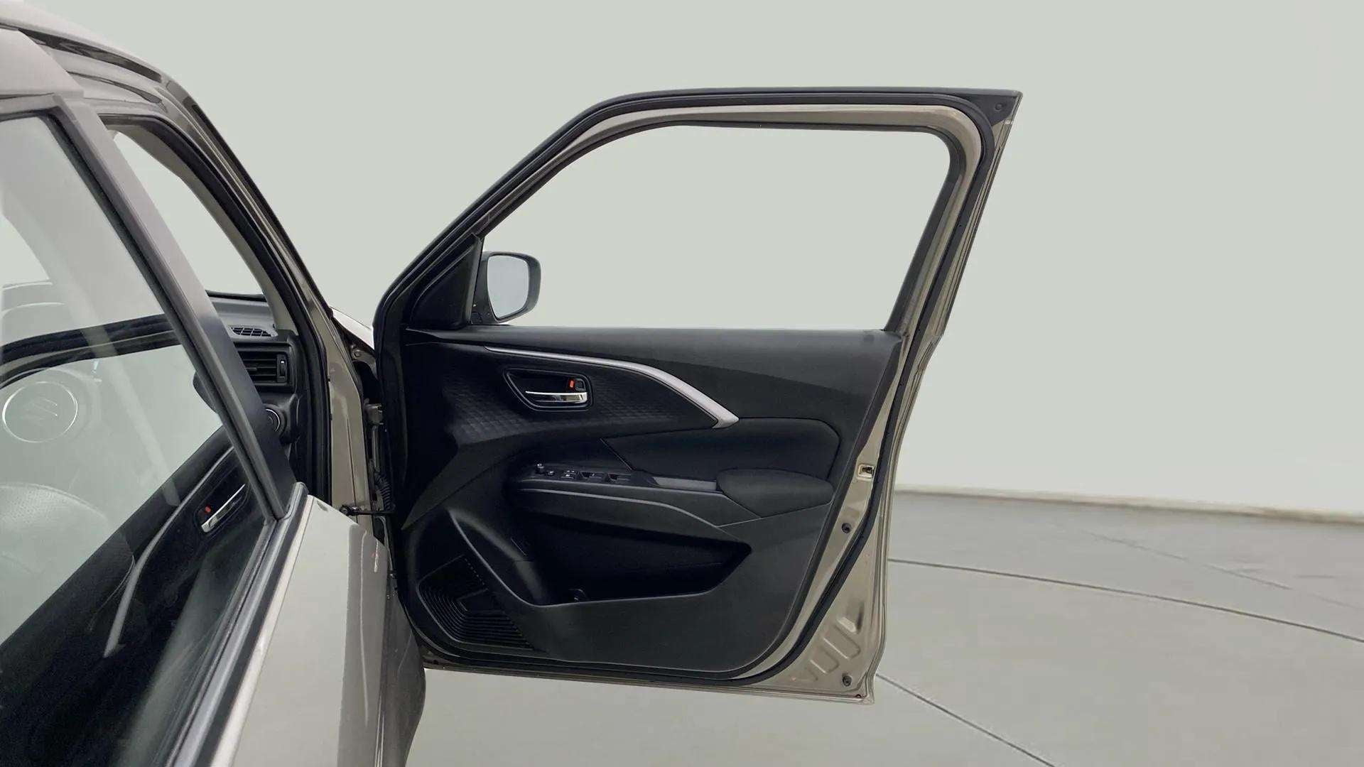 Front driver door interior of a Maruti Suzuki Swift