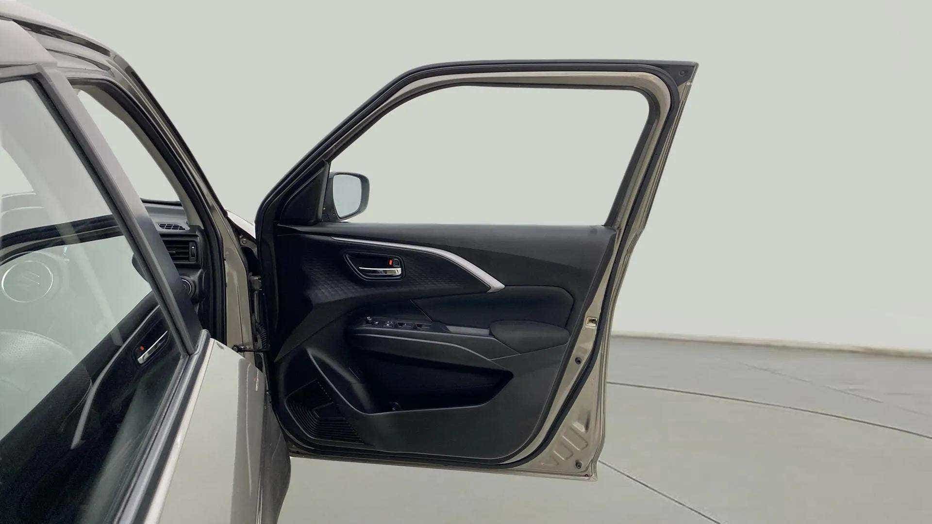 Front driver door interior of a Maruti Suzuki Swift