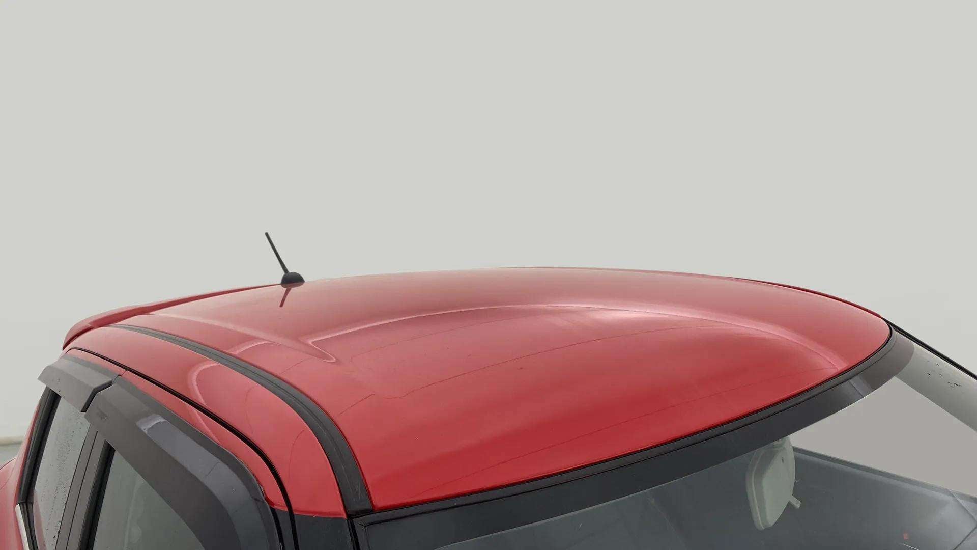 Roof view of a solid fire red maruti suzuki swift 2021 - 2023