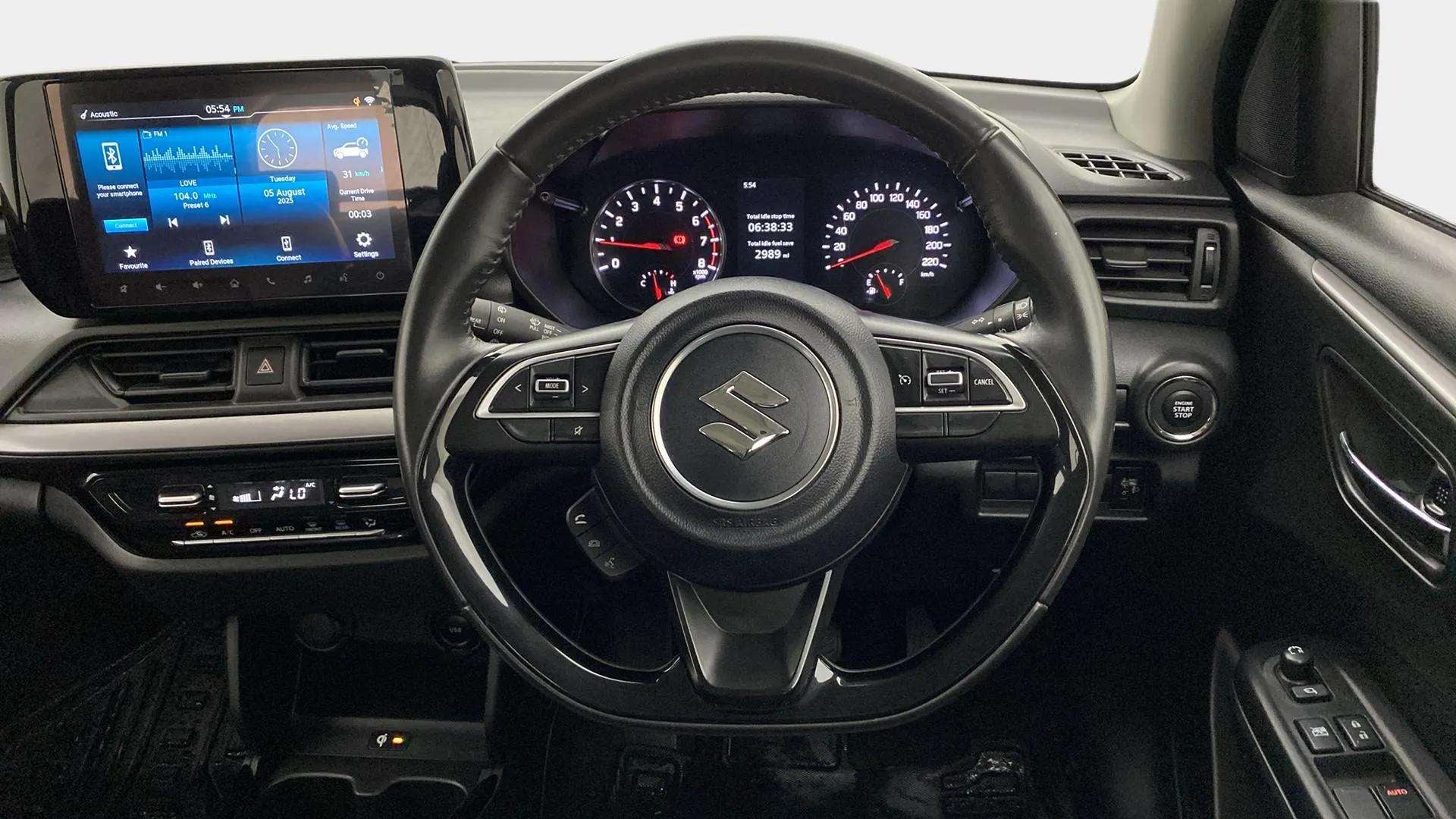 Interior dashboard view of a Maruti Suzuki Swift