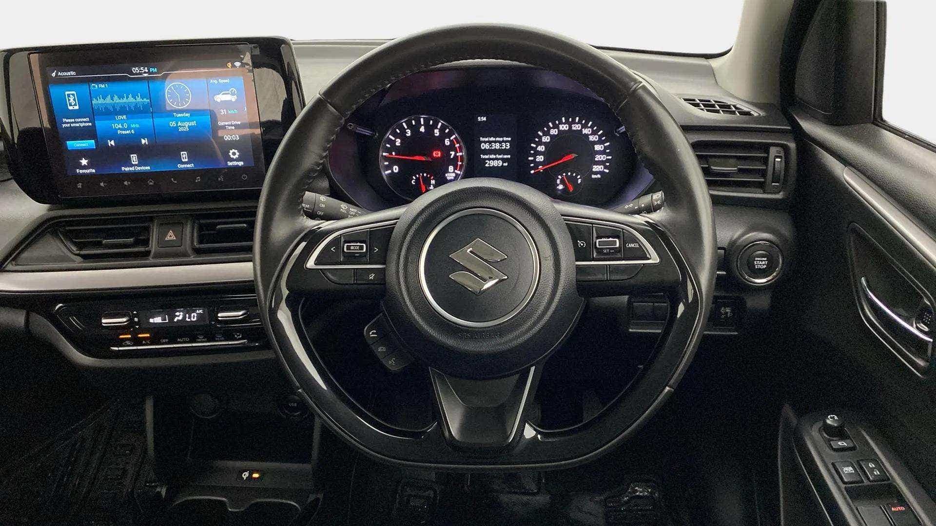 Interior dashboard view of a Maruti Suzuki Swift