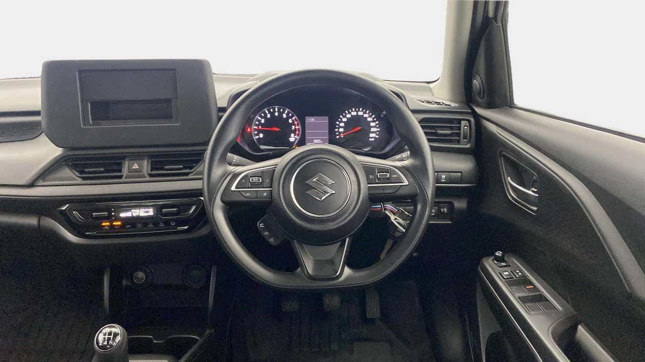 Interior dashboard view of a Maruti Suzuki Swift