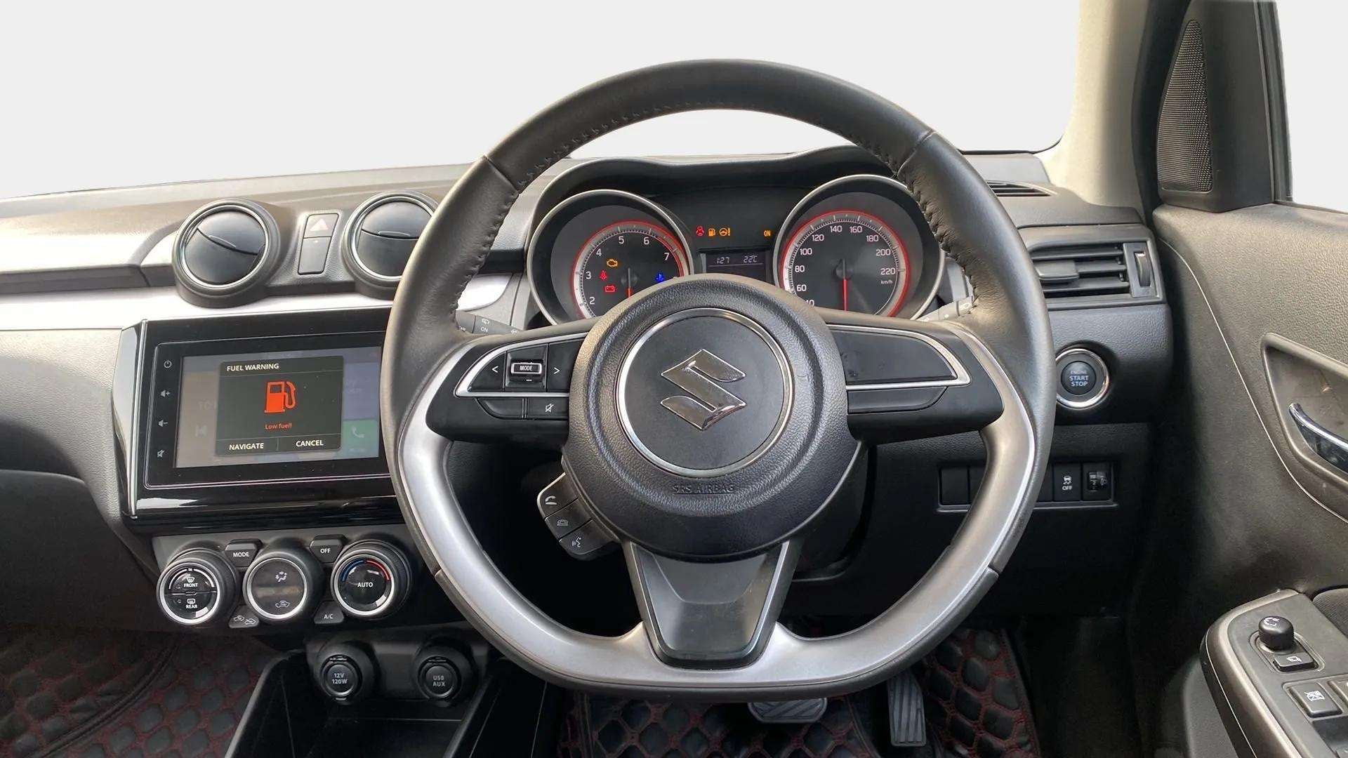 Interior dashboard view of a Maruti Suzuki Swift 2021 - 2023