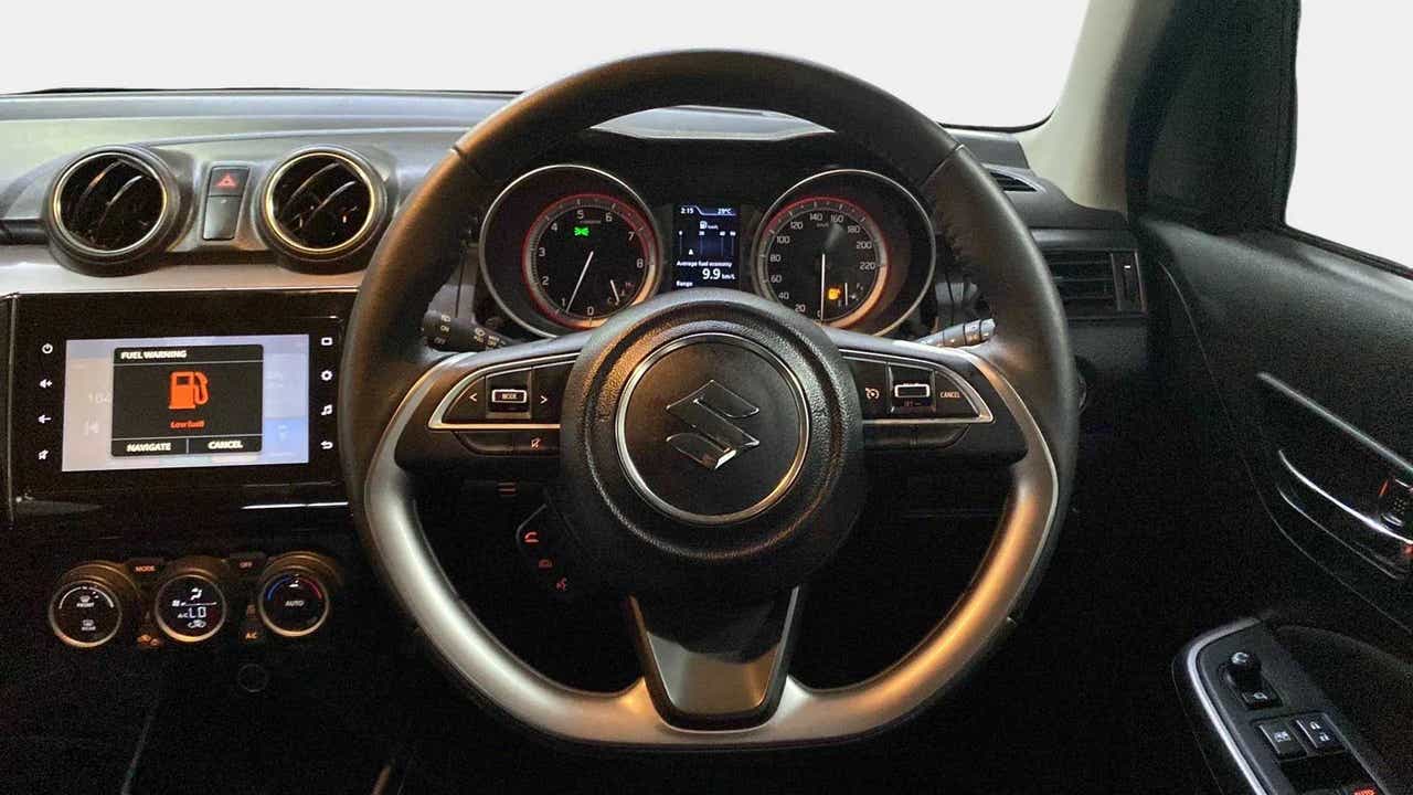 Steering wheel and dashboard of a Maruti Suzuki Swift 2021 - 2023