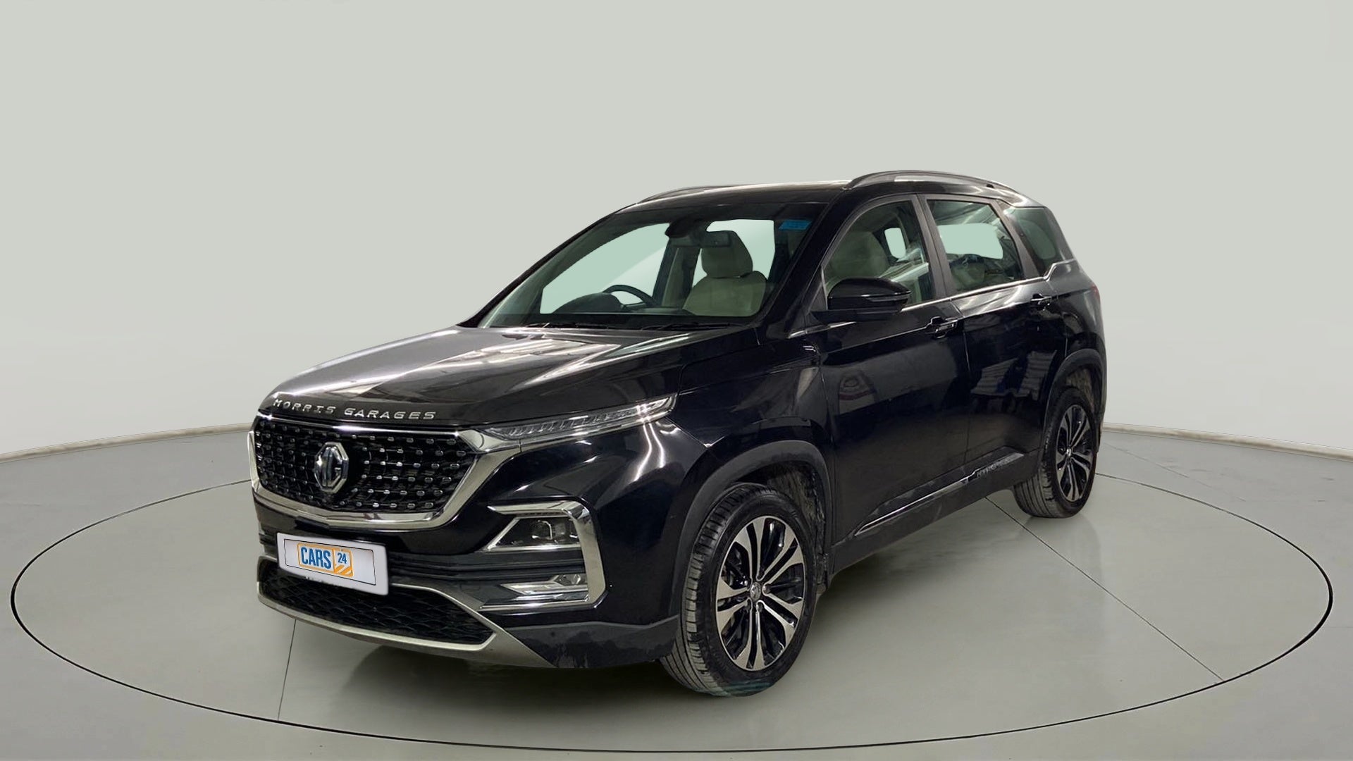 Front three-quarter view of a starry-black MG Hector