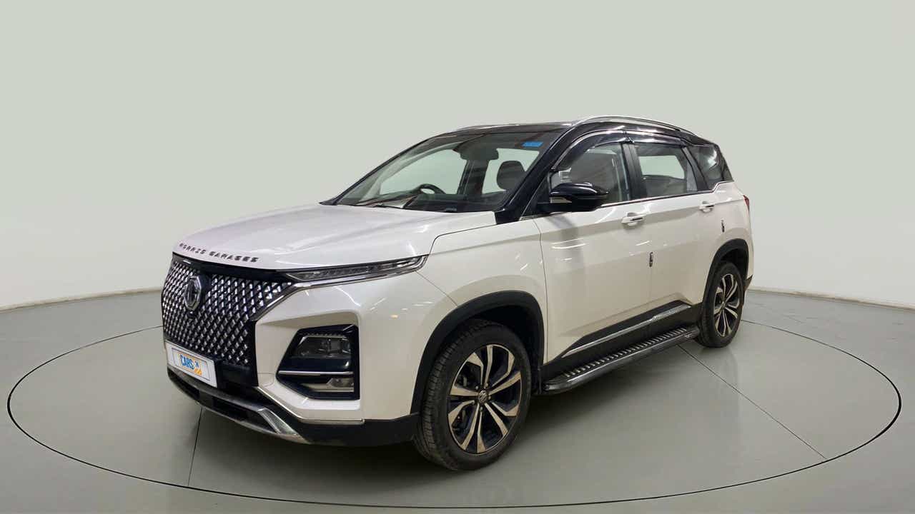 Front three-quarter view of a candy white with satrry black MG Hector