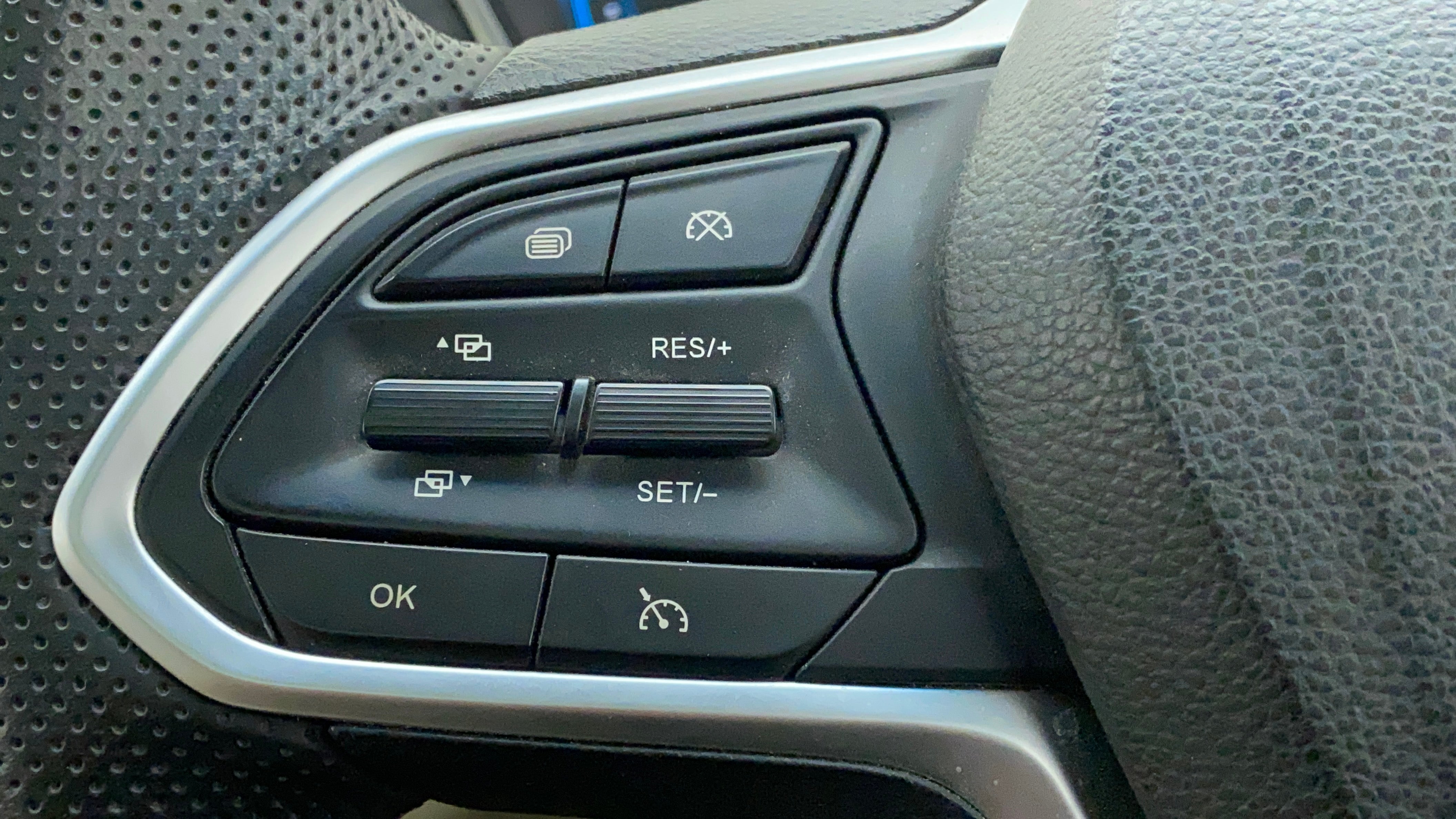 Steering wheel control buttons of a MG Hector