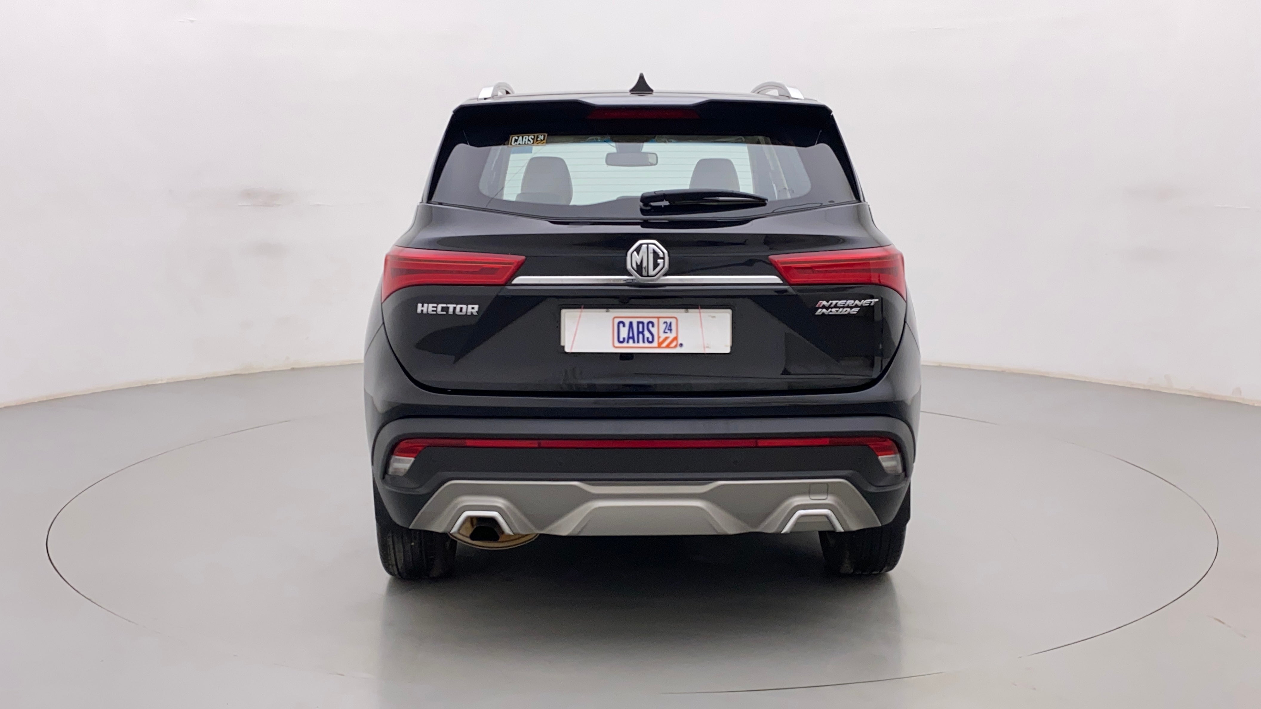 Rear view of a starry-black MG Hector