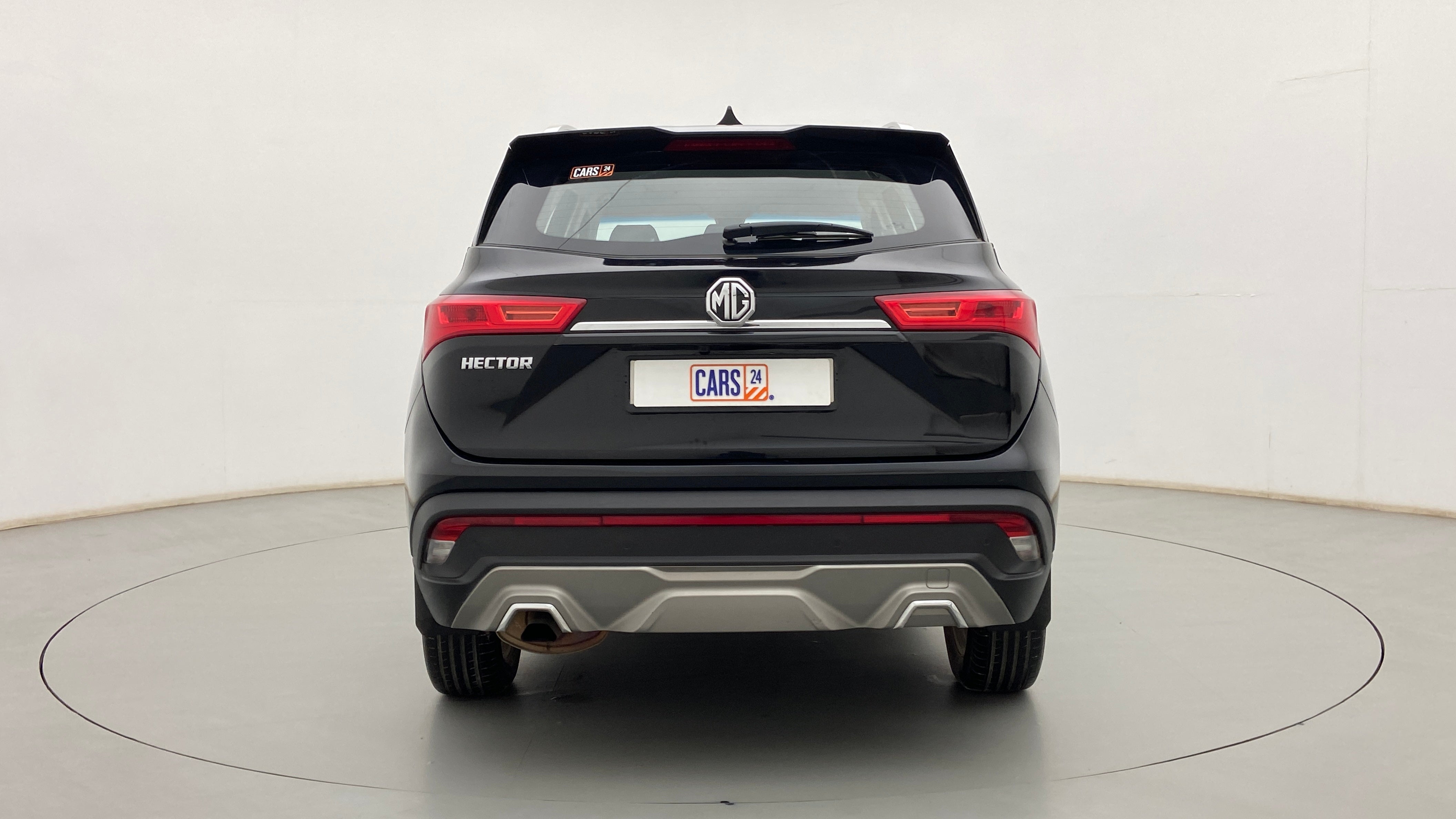 Rear view of a starry black MG Hector