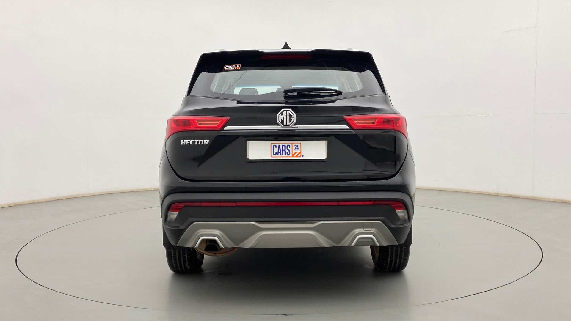 Rear view of a starry black MG Hector