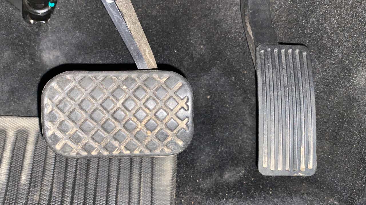 Close-up view of pedals in an MG Hector