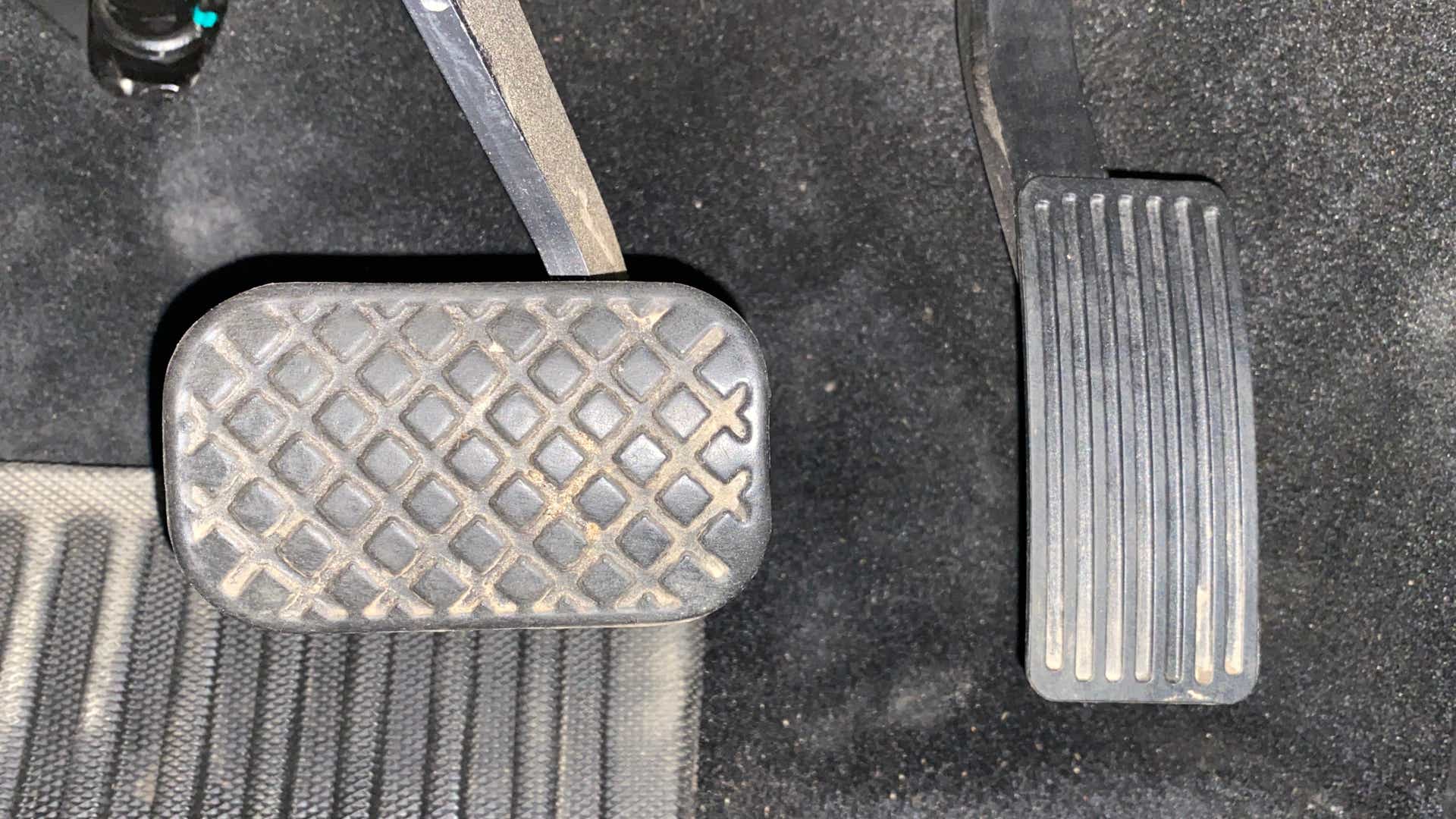 Close-up view of pedals in an MG Hector