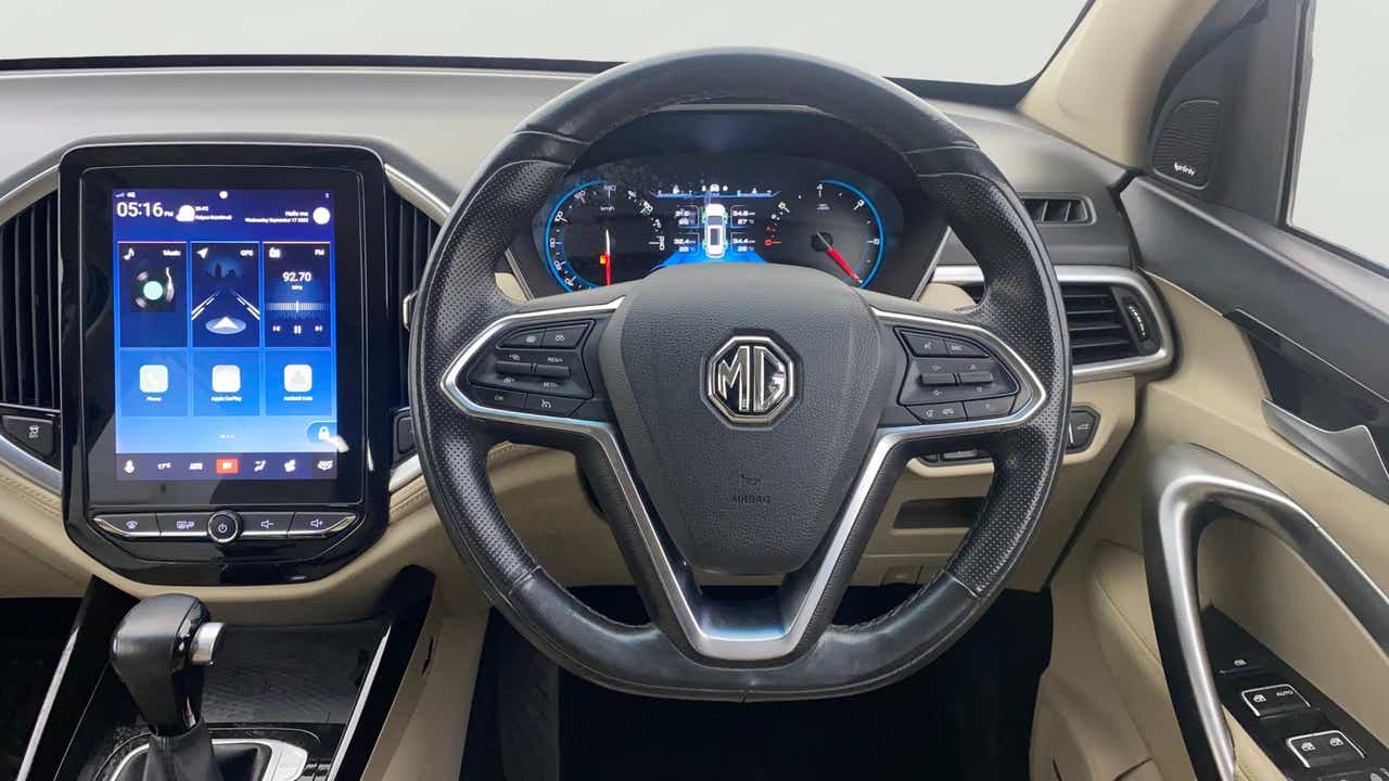 Interior dashboard and steering wheel of a MG Hector