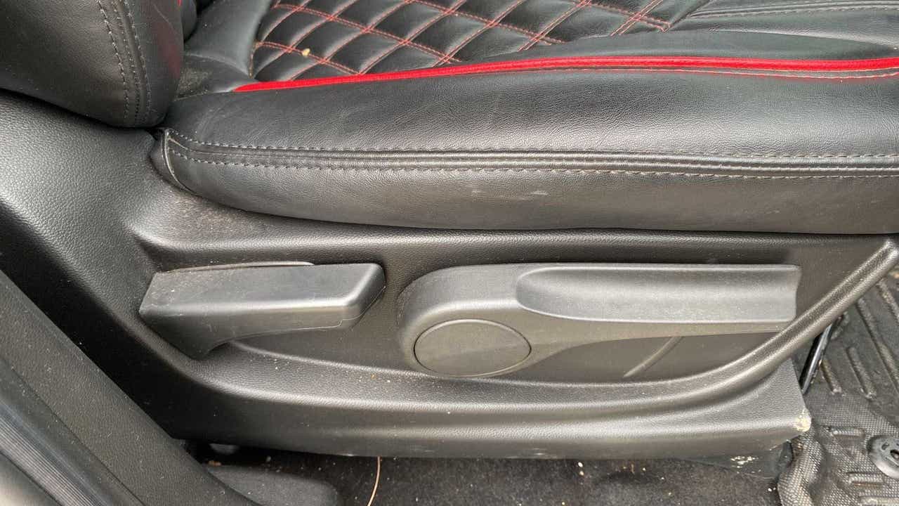 Front seat controls and upholstery of a MG Hector