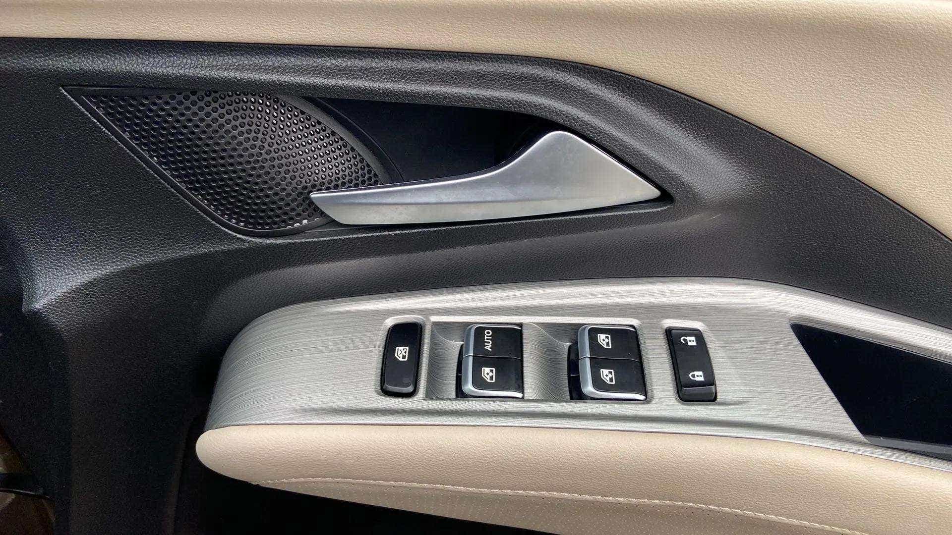 Close-up of interior door controls of a MG Hector