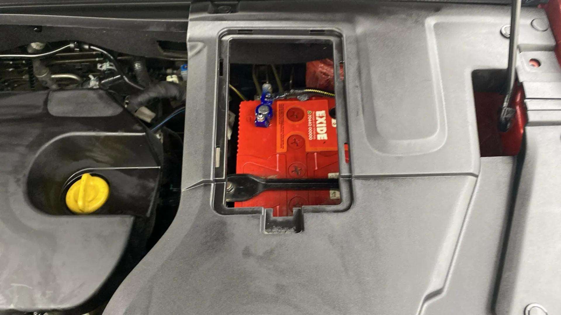 Engine bay battery compartment of a MG Hector