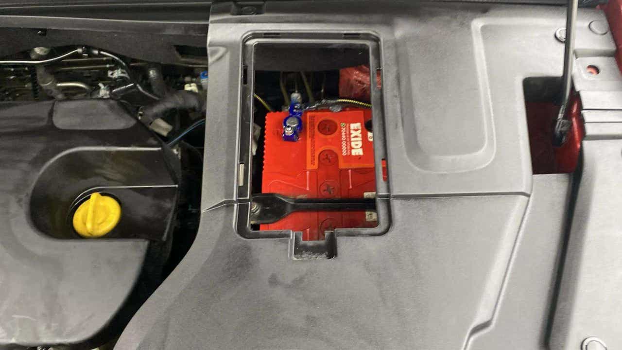 Engine bay battery compartment of a MG Hector