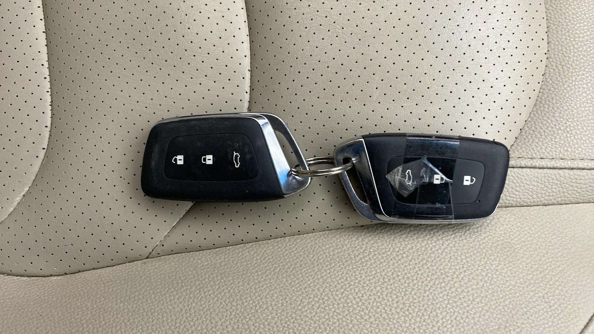 Car key fobs on leather seat of an MG Hector