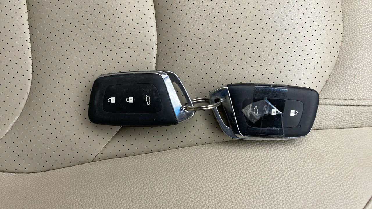 Car key fobs on leather seat of an MG Hector