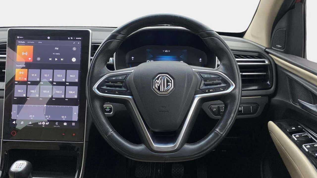 Dashboard and steering wheel view of a MG Hector