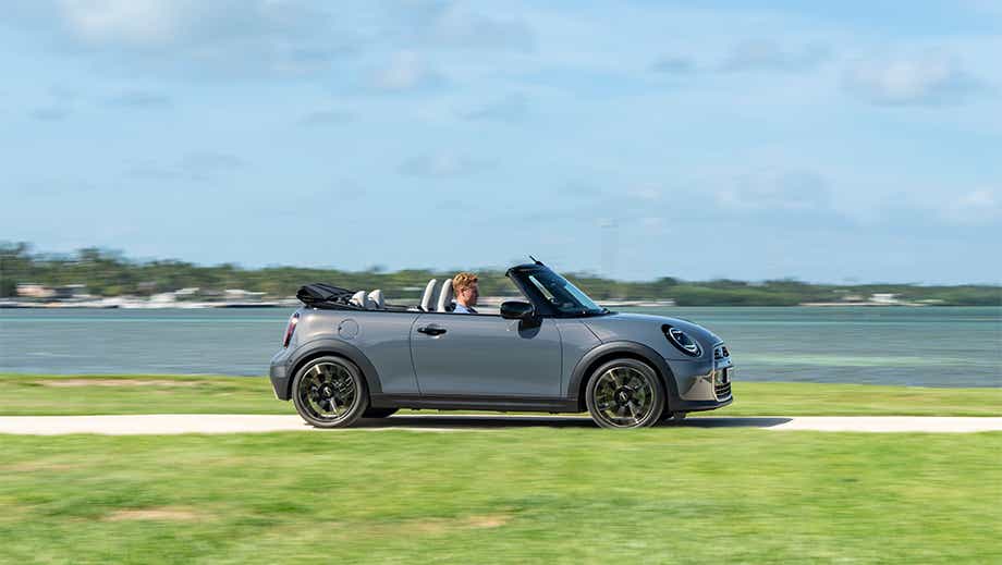 Profile view of a Mini Cooper S Convertible with the top down