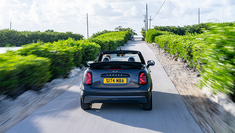 Rear view of a Mini Cooper S Convertible on a countryside road