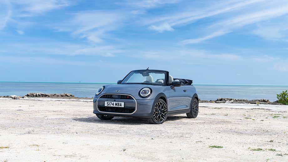 Front three quarter of a Mini Cooper S Convertible on a beach