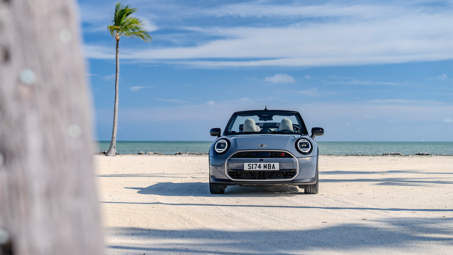 Front view of a Mini Cooper S Convertible on a beach