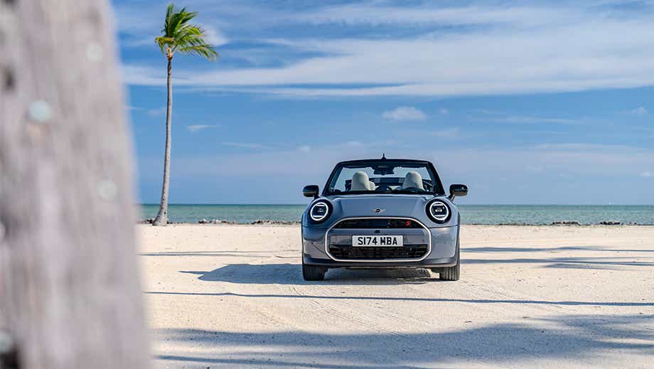 Front view of a Mini Cooper S Convertible on a beach