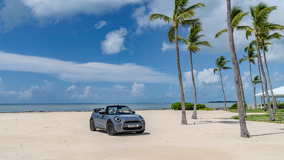 Front three quarter view of a Mini Cooper S Convertible on a beach