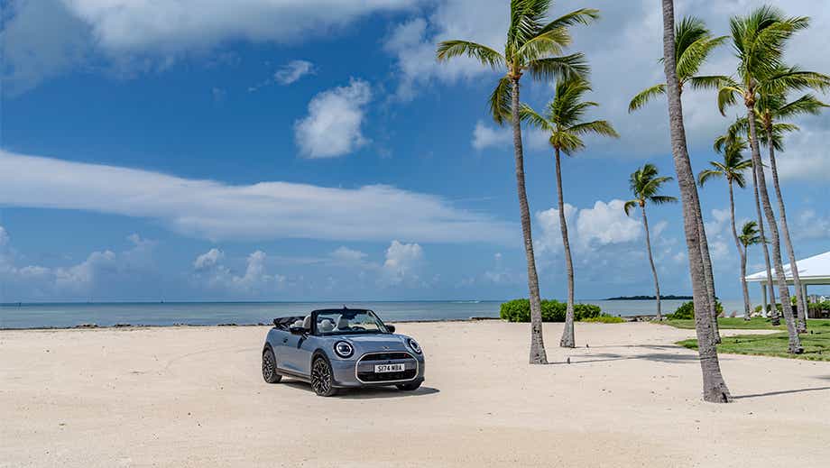 Front three quarter view of a Mini Cooper S Convertible on a beach