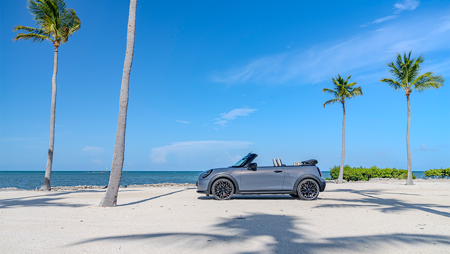Side view of a Mini Cooper S Convertible on a beach